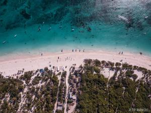 people standing on top of a beach at Kai Tulum in Tulum