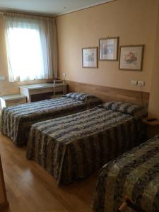 Postel nebo postele na pokoji v ubytování Hotel Concordia + 37 fotografií