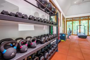 a row of dumbbells in a gym at Nomad Beach Resort in Diani Beach