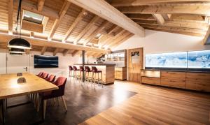 a dining room with a large aquarium in the ceiling at Alpenhotel Schlüssel in Andermatt