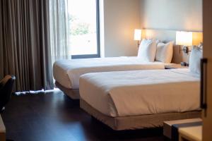 Tempat tidur dalam kamar di Hyatt Place Altoona/Des Moines