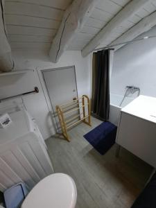 a bathroom with a toilet and a sink and a desk at Altissim Apartments in Pas de la Casa +211 photos