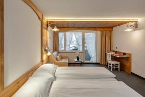 Una cama o camas en una habitación de Hotel Antika
