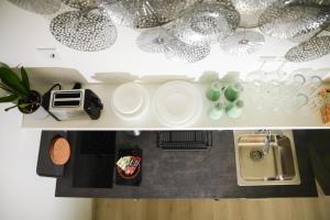 A kitchen or kitchenette at Rába Apartman House