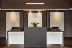 a lobby with a reception desk with a plant on it at Hyatt Place Philadelphia/ King of Prussia in King of Prussia