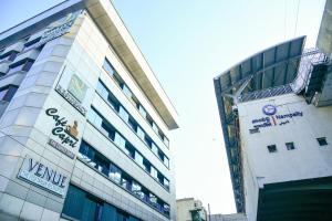 a building with a sign on the side of it at Quality Inn Residency in Hyderabad