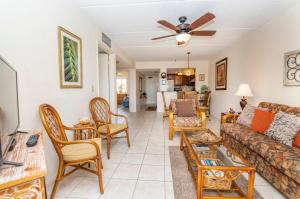 a living room with a couch and chairs at Unit 8213 - Ocean & Racquet Resort in Saint Augustine Beach