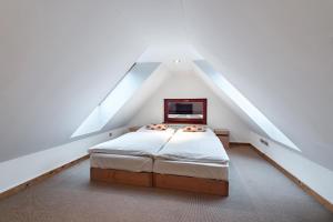 Ein Bett oder Betten in einem Zimmer der Unterkunft Kukučka Lomnica - Tatranská Lomnica