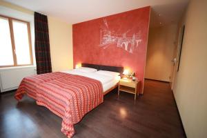 Llit o llits en una habitació de Hotel Albula & Julier