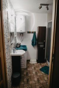 a small bathroom with a sink and a mirror at Domek Sienna 1a Czarna Góra in Stronie Śląskie +40 photos