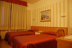 Postel nebo postele na pokoji v ubytování Hotel Belie