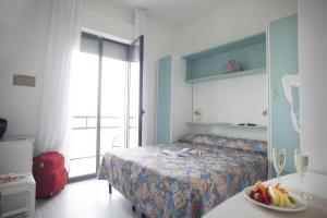 Postel nebo postele na pokoji v ubytování Hotel Oceania
