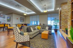 a lobby with a couch and chairs and tables at Drury Inn & Suites San Antonio Near La Cantera in San Antonio