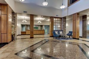 an empty lobby with a table and chairs at Drury Inn & Suites Phoenix Happy Valley in Phoenix