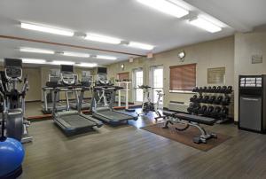 a gym with several treadmills and machines in a room at Candlewood Suites Sumter, an IHG Hotel in Sumter