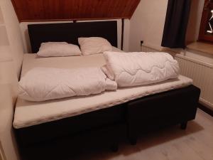Кровать или кровати в номере Lodewijkhoeve