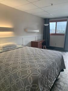 Postel nebo postele na pokoji v ubytování Marina Motel