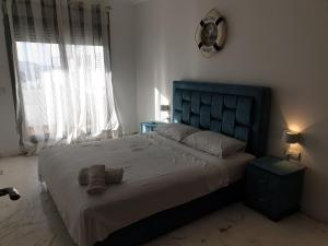 Ένα ή περισσότερα κρεβάτια σε δωμάτιο στο City Bleu Tanger