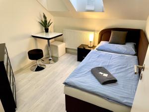 Postelja oz. postelje v sobi nastanitve Hotel Stará Pošta