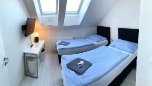 Postelja oz. postelje v sobi nastanitve Hotel Stará Pošta