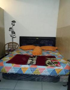 En eller flere senge i et værelse på Villa Vander