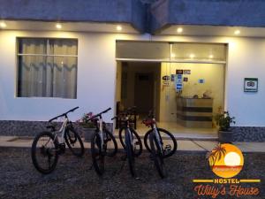 a group of bikes parked in front of a building at Hostel Willys House in Paracas