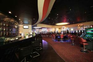 a bar with a lot of bar stools at Antay Casino Hotel in Copiapó