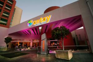 a building with a company sign on the side of it at Antay Casino Hotel in Copiapó