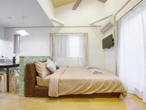 Łóżko lub łóżka w pokoju w obiekcie nestay villa tokyo takanawa
