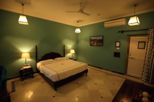 Voodi või voodid majutusasutuse Shahpura Kumbhal Villas toas