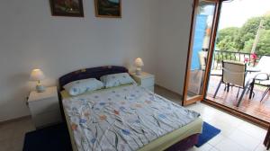 Postel nebo postele na pokoji v ubytování Apartments Lastavica
