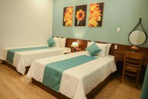 Uma cama ou camas num quarto em AnAn Homestay Huế