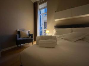 Posteľ alebo postele v izbe v ubytovaní Domus Suites Verona