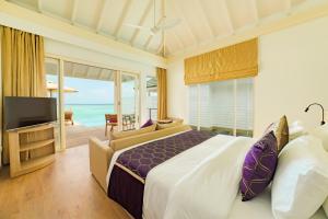Postel nebo postele na pokoji v ubytování Siyam World Maldives - 24-Hour Premium All-inclusive with Free Transfer