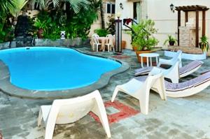 A piscina em ou perto de 2 bedrooms appartement with shared pool furnished terrace and wifi at Pereyber 1 km away from the beach