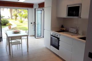 A kitchen or kitchenette at Spacious Apartment in Tarragona + Pool