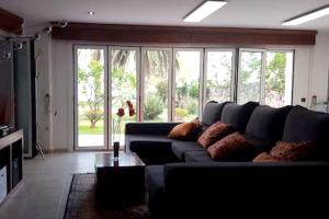 A seating area at Spacious Apartment in Tarragona + Pool