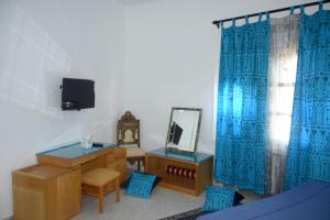 a bedroom with a vanity and a mirror and a dresser at 5 bedrooms villa at Monastir 200 m away from the beach with private pool enclosed garden and wifi in Monastir