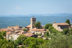 a village with a church on top of a hill at Maison charmante à Montauroux avec jacuzzi et vue in Montauroux