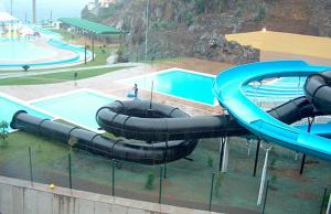 an empty water slide in a pool at a park at Charming house in Santa Cruz with sea view in Santa Cruz