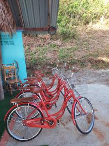 two red bikes parked next to each other at Cliff Cottage in Ko Chang