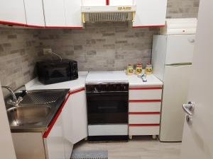 Η κουζίνα ή μικρή κουζίνα στο Charming apartment in Canicatti, 40 m² with private terrace. +7 φωτογραφίες