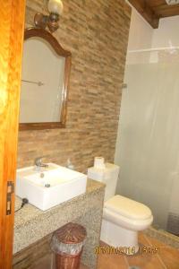 a bathroom with a sink and a toilet and a mirror at Charming Villa near Anta with Private Pool in Anta