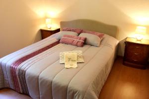 a bedroom with a large bed with a sign on it at Peaceful villa in São Martinho de Mouros with private pool in Frende +29 photos