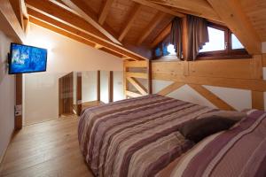 Rúm í herbergi á Agriturismo I Comelli