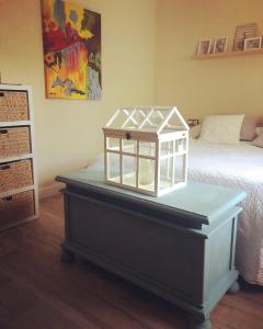 a bedroom with a bed with a glass box on a table at Chalet en plena naturaleza in Tortosa