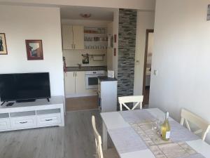 A kitchen or kitchenette at Apartmán Lesníček