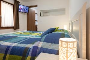 Rúm í herbergi á Agriturismo I Comelli