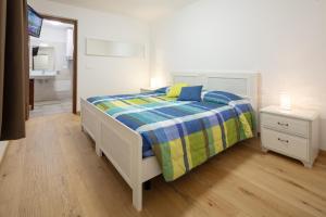 Rúm í herbergi á Agriturismo I Comelli