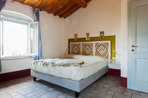 Postel nebo postele na pokoji v ubytování Poderi in Chianti